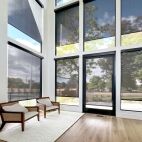 entryway with tall windows - motorized solar screen roller shades
