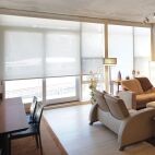 condo with white solar screen roller shades
