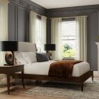 faux wood blinds in bedroom layered under curtains