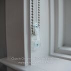 Clear chain tension device with silver chain clutch operated shade
